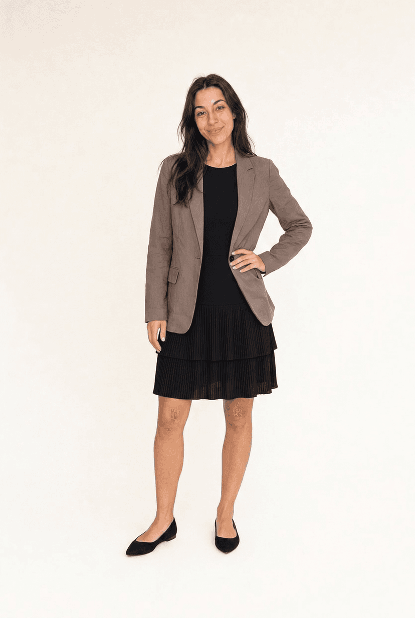 Elegant theatre outfit — black midi dress with brown blazer